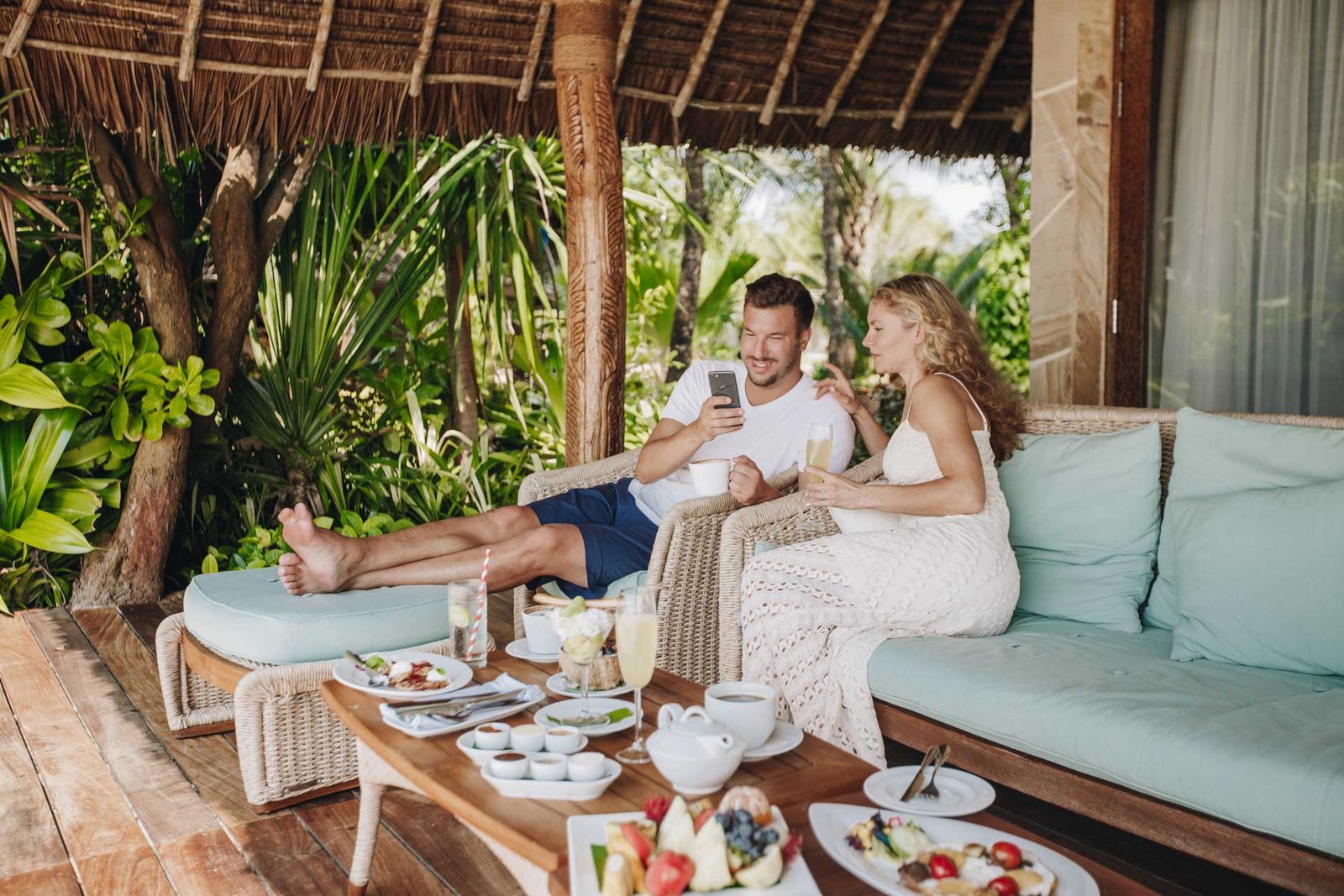Couple relaxing in their luxury villa in Zanzibar after their honeymoon safari in Tanzania